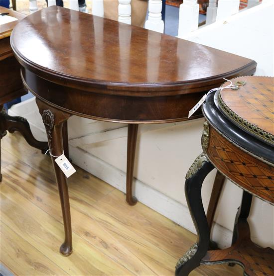 An Edwardian mahogany demi-lune card table W.86cm